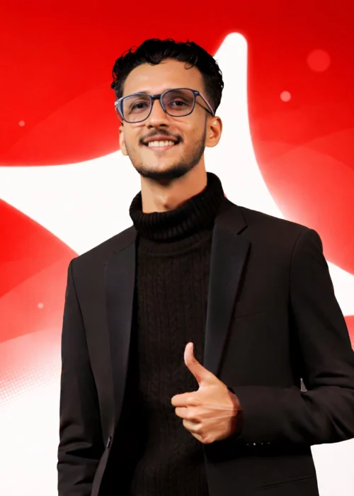 Portrait of Joydip Kirtunia, Founder and CEO, standing confidently against a modern red and white abstract background representing professionalism and digital expertise.